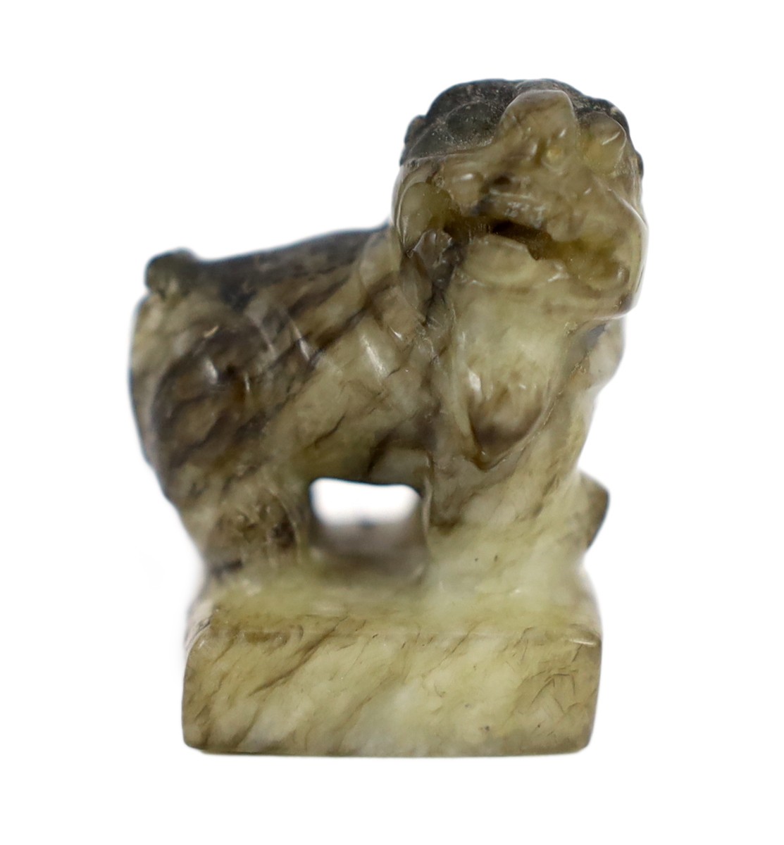 A Chinese pale celadon and black jade ‘lion-dog’ seal, 18th/19th century, 3.9cm high